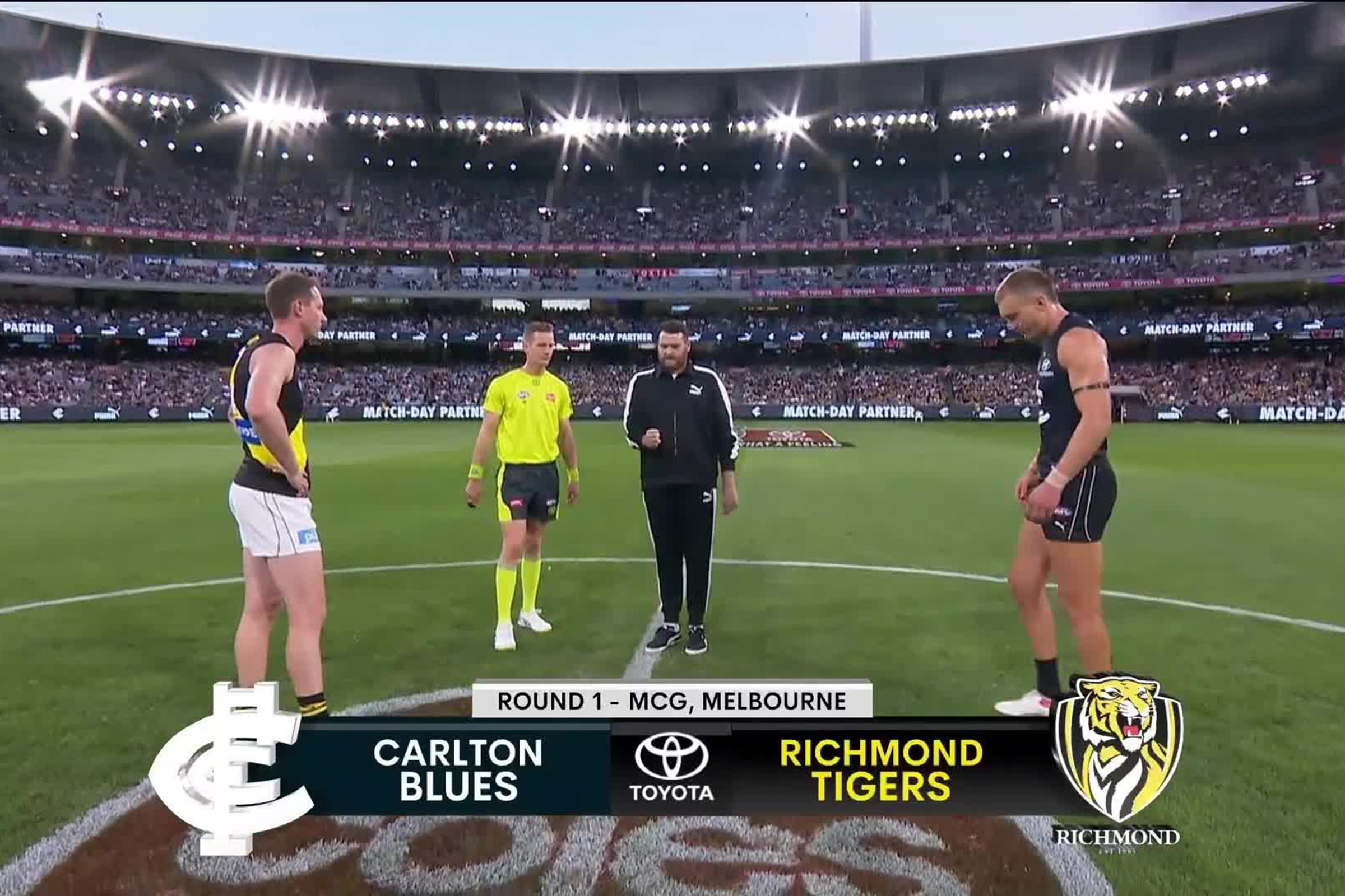 AFL teams Carlton Blues and Richmond tigers captains waiting for the coin flip at round 1 MCG funny coin toss